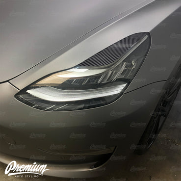 2017-2020 Tesla Model 3 Headlight Eyelid Vinyl Accent Overlay v1 (Large) - Carbon Fiber