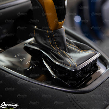 INSTALLATION INSTRUCTIONS: First pull up on the chrome shifter trim boot.