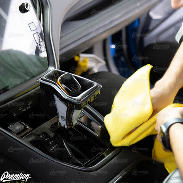 Once you position the protection film in the correct spot, use a hard squeegee and microfiber towel to remove as the spray solution from under the protection film. (Shown using a microfiber towel to remove excess solution).