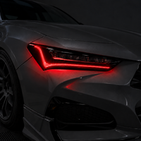 2021–2025 Acura TLX headlight with transparent red DRL tint and gloss black amber-delete vinyl installed