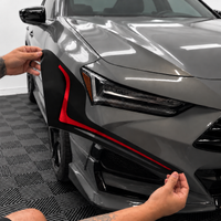 2021–2025 Acura TLX headlight with transparent red DRL tint and gloss black amber-delete vinyl installed