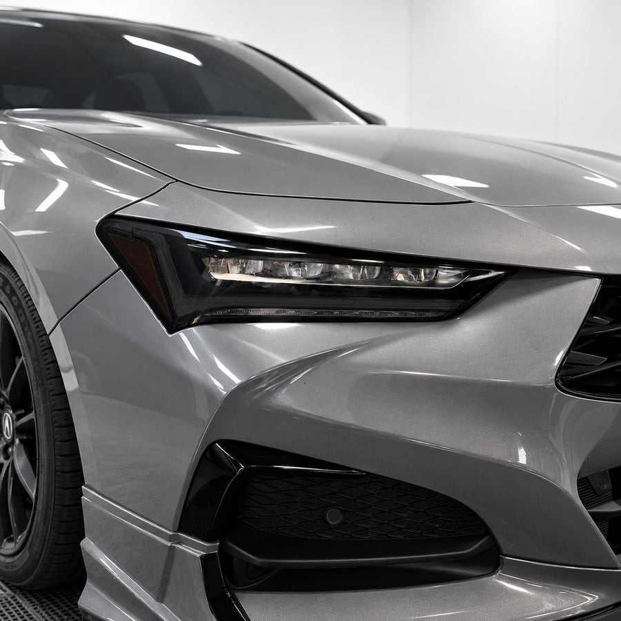 2021–2025 Acura TLX headlight with smoked tint covering the DRL and factory amber reflector areas
