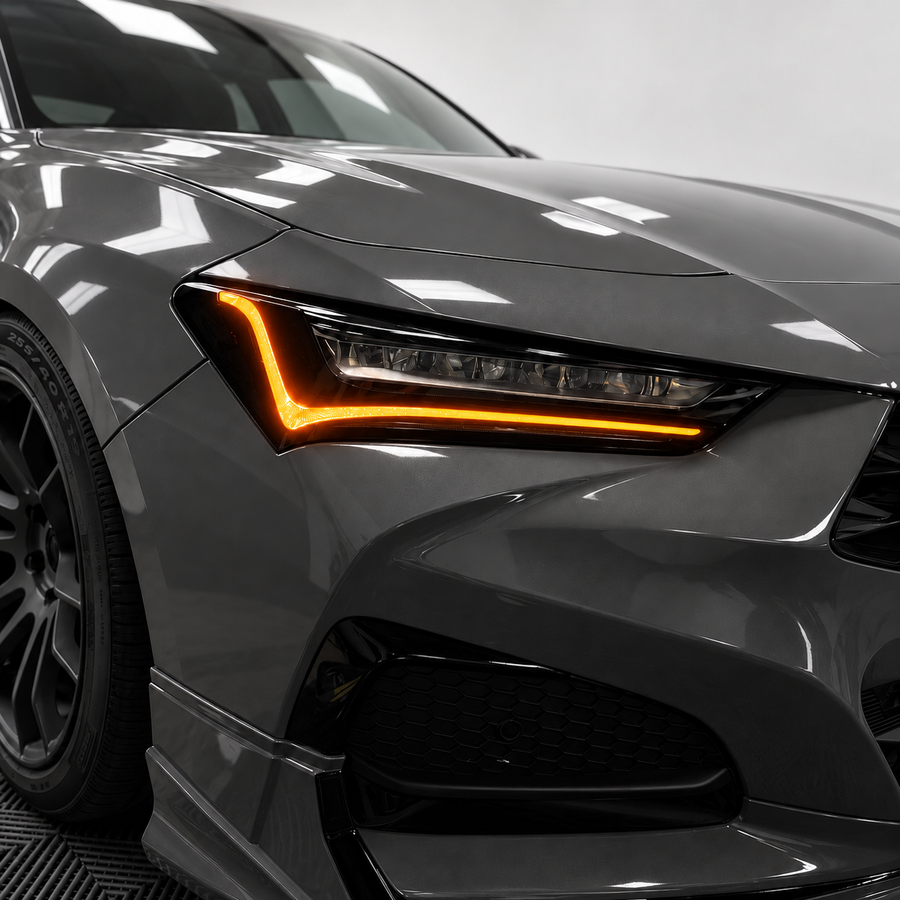 2021–2025 Acura TLX headlight with amber-orange DRL tint and gloss black amber-delete vinyl installed