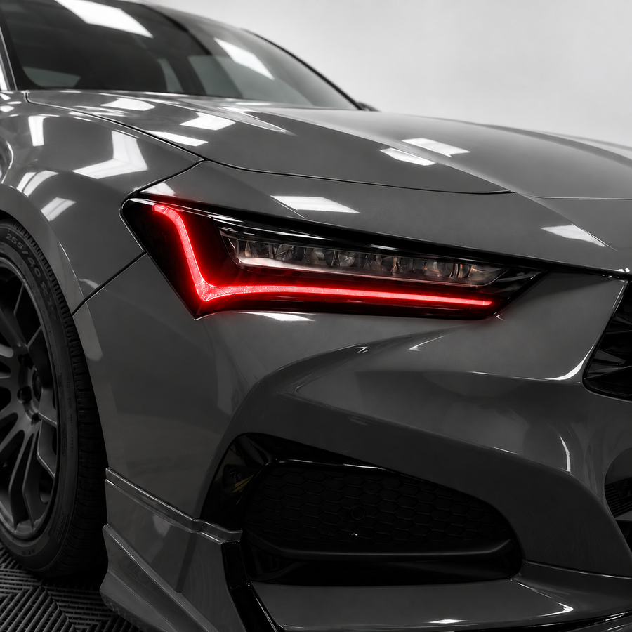 2021–2025 Acura TLX headlight with transparent red DRL tint and gloss black amber-delete vinyl installed