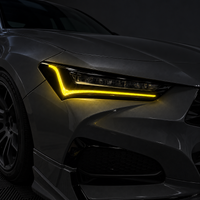 2021–2025 Acura TLX headlights with yellow DRL tint and amber-delete vinyl overlays installed