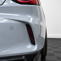 2021–2025 Acura TLX rear bumper reflector with smoked vinyl tint overlay installed