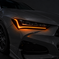 2021–2025 Acura TLX headlight with amber-orange DRL tint and gloss black amber-delete vinyl installed