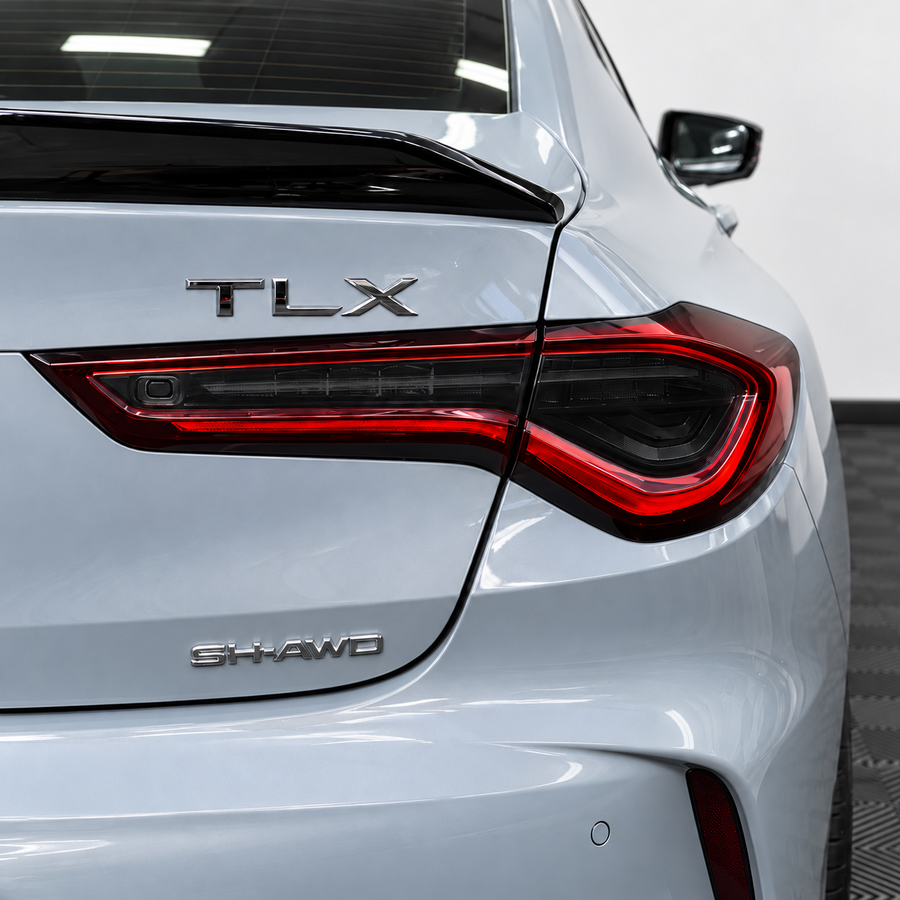 2021–2025 Acura TLX factory taillight with smoked vinyl tint overlays installed