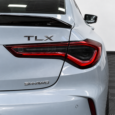 2021–2025 Acura TLX factory taillight with smoked vinyl tint overlays installed