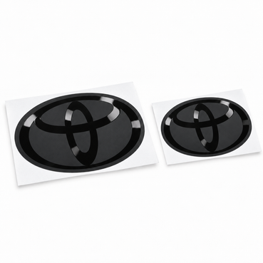 Front and rear GR Corolla vinyl emblem overlays with satin black bases and gloss black Toyota logos