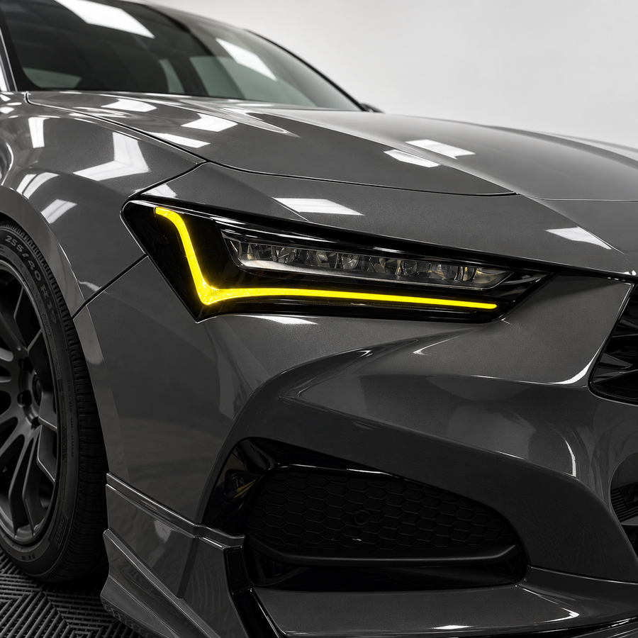 2021–2025 Acura TLX headlights with yellow DRL tint and amber-delete vinyl overlays installed