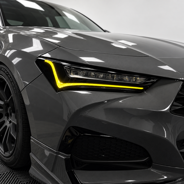2021–2025 Acura TLX headlights with yellow DRL tint and amber-delete vinyl overlays installed